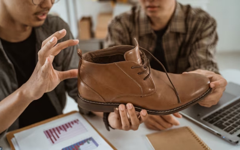 two businessmen chatting about shoes